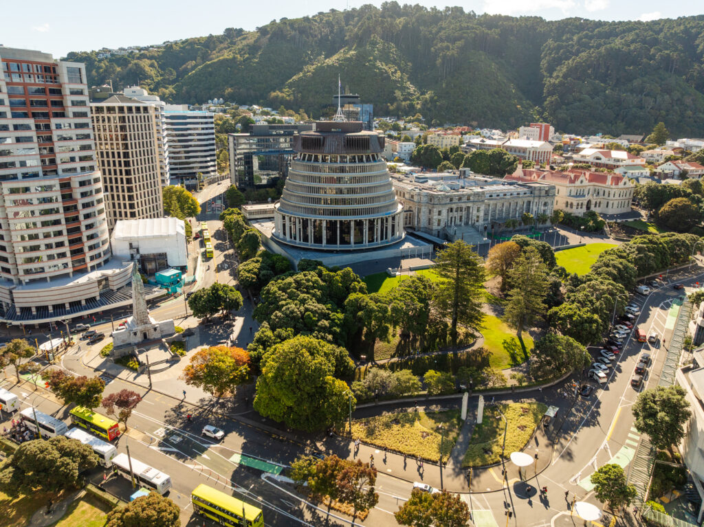Areal photos of New Zealand Parliament and the Pipitea Campus from a drone. Afternoon light. Rutherford House, Old Government Buildings. Railway Station, harbour views.